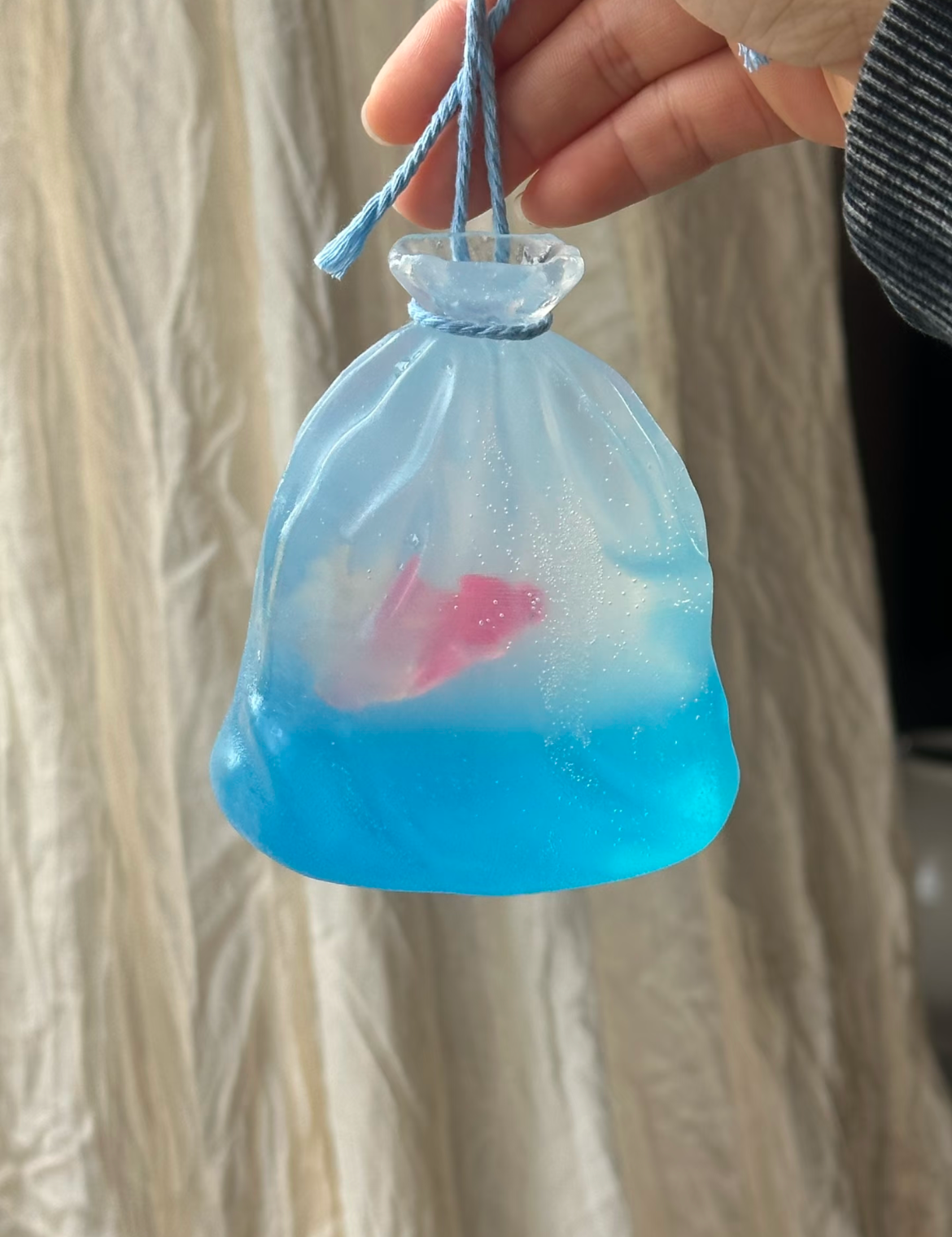 Handmade ocean-scented soap shaped like a goldfish pouch