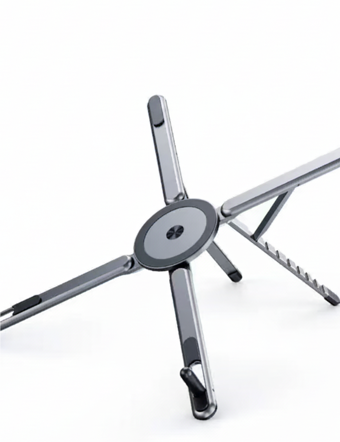Adjustable foldable laptop stand with magnetic cable ring, silver, on a desk